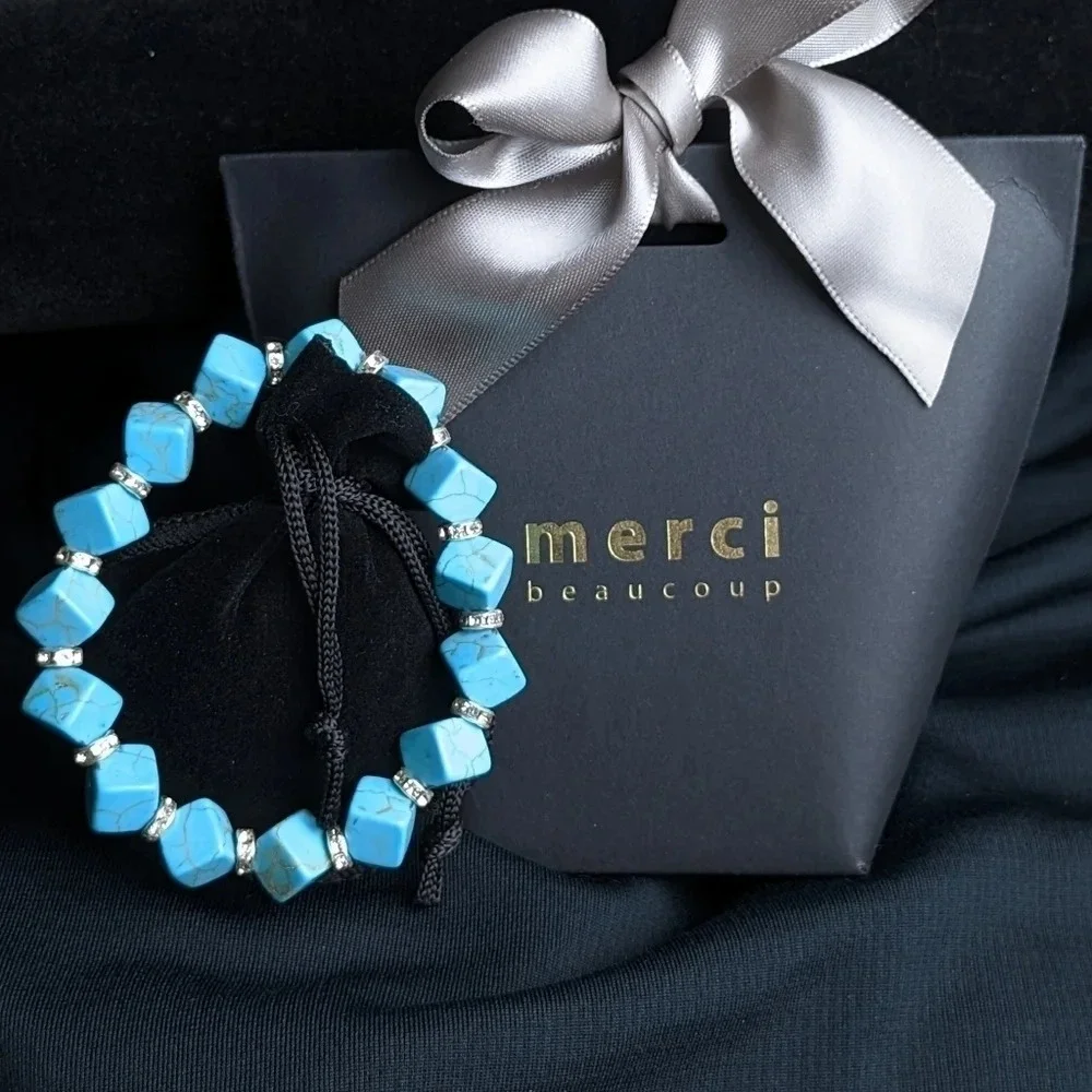 Pretty faux turquoise color beaded bracelet with CZ accents, cube shape beads